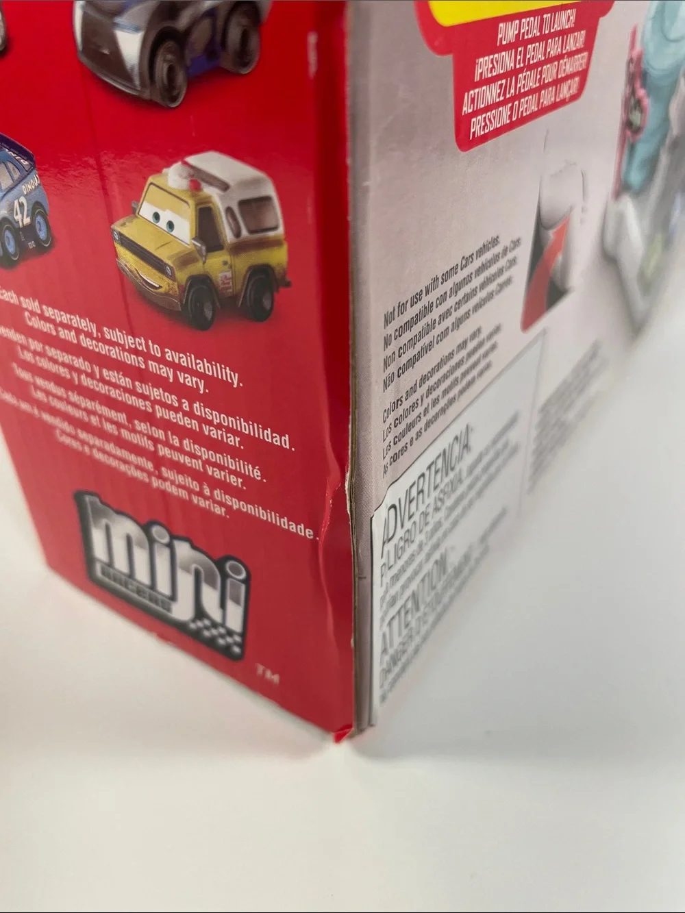 Mini Racers-Cardboard Packaging has dents and a torn spot as shown